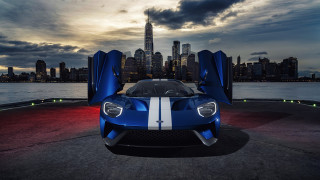 Blue sports car city skyline - a blue sports car free wallpaper