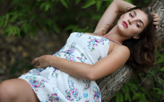 Woman laying tree branch dress - her arm behind her head free wallpaper for desktop