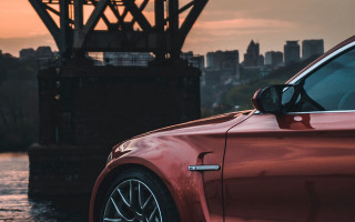 Red car bridge city sunset - a bridge in the background free wallpaper