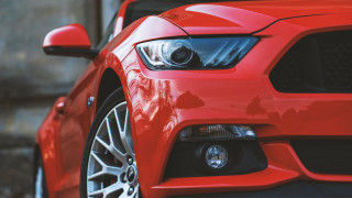 Red mustang headlights grill building - a building in the background free wallpaper