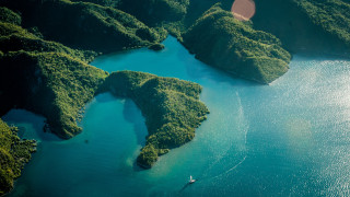 Boat green hills night starry - aerial free wallpaper