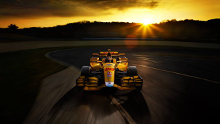 Yellow race car sunset landscape - a yellow race car free wallpaper
