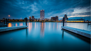 City skyline lake dock night - a dock in the foreground free wallpaper