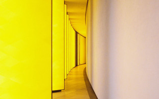 Long hallway yellow walls clock - a long hallway free wallpaper
