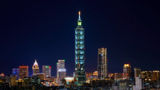 City skyline tower lit night - a tall building free wallpaper