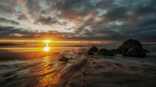 Sunset beach rocks water cloudy 2 - the sun setting free wallpaper