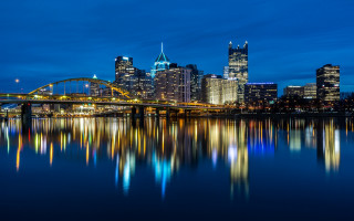 City skyline bridge river night 84 - the water and a bridge in the foreground free wallpaper