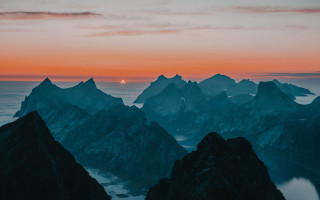 Sunset mountain range lake distant - orange sky free wallpaper