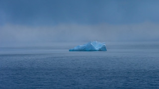 Iceberg foggy ocean blue sky - a large iceberg free wallpaper