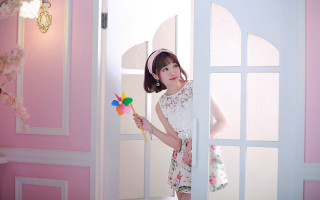 Pink girl pinwheel doorway floral - a little girl holding free wallpaper