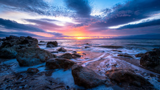 Sunset rocky beach waves clouds 4 - wave free wallpaper