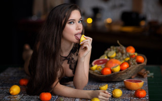 Woman eating fruit still life - transgressive free wallpaper
