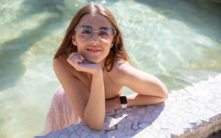 Girl glasses sitting pool smile - a ledge next free wallpaper