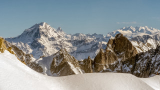 Skier snowy mountain top panorama - bernard meninsky free wallpaper for desktop