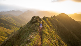 Woman hiking mountains sunset nature - a sunset in the distance free wallpaper for desktop