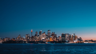 City skyline night water boat 9 - a boat in the foreground free wallpaper for desktop