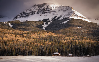 Mountain snowy forest cabin cloudy - a cloudy sky free wallpaper