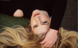 Blonde woman laying illusion portrait - emma geary free wallpaper