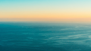 Ocean plane sunset minimalism tiltshift - a plane window free wallpaper