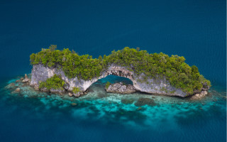 Island cave surrounded by water - in the middle of it free wallpaper