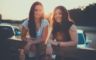 Two women bench truck sunset - a truck free wallpaper