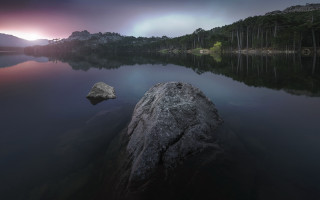 Large rock lake cloudy purple - top of a lake under a cloudy sky free wallpaper