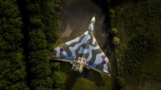 Camouflaged jet tiltshift forest reddot - a red dot free wallpaper
