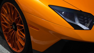 Bright orange sports car front - a close up free wallpaper for desktop