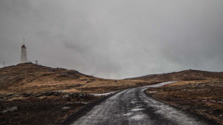 Dirt road lighthouse cloudy gray - a gray sky free wallpaper