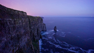 Cliff lighthouse night purple sky - a lighthouse free wallpaper