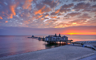 Pier building sunset clouds boats - bernt tunold free wallpaper