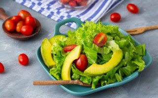 Salad avocado tomatoes spoon background - the side with free wallpaper