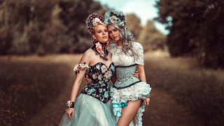 Two women costumes field hugging - costume free wallpaper for desktop