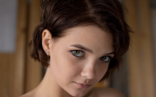 Serious woman blue eyes portrait - a short haircut free wallpaper