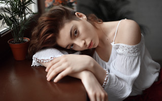 Woman sitting plant portrait blurry - pale free wallpaper