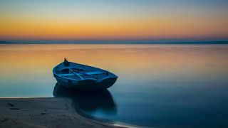 Small boat lake sunset reflection - a small boat free wallpaper for desktop