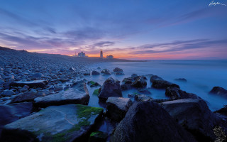 Beach rocks lighthouse sunset longexposure - a long exposure of light free wallpaper