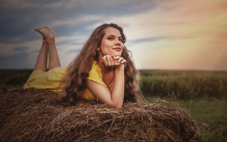 Woman haybale field crossed portrait - under her chin free wallpaper