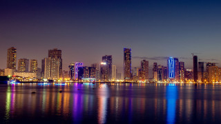 City skyline lake boat night - hurufiyya free wallpaper