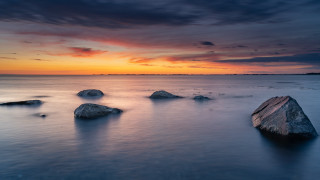 Sunset mountains water rocks clouds - the foreground and a sky free wallpaper