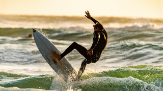 Surfing man wave ocean sunset - a surfboard free wallpaper