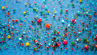 Blue background colored balls confetti 2 - kinetic pointillism free wallpaper