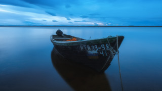 Lake boat cloudy night rope - top of a lake under a cloudy sky free wallpaper