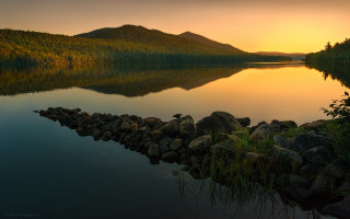 Lake rock wall mountain sunset - a mountain in the background free wallpaper