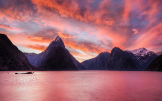 Boat lake mountains sunset pink - rich moody colours free wallpaper