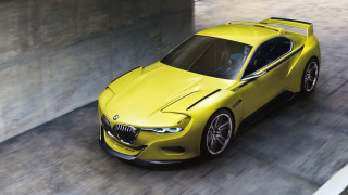Yellow bmw concept car tunnel - a concrete wall behind free wallpaper