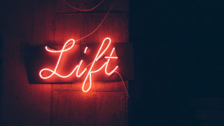 Neon sign lift dark room - a neon sign free wallpaper