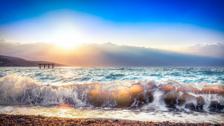 Beach waves pier sunset ocean - a bright sun in the sky free wallpaper for desktop