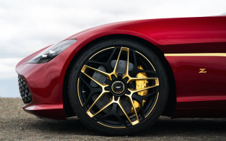 Red sports car gold accents - sharp detail free wallpaper