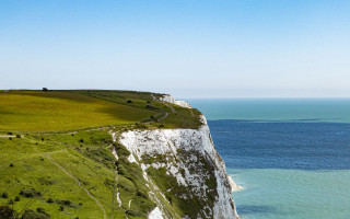 White cliff grassy field ocean - free landscape wallpaper